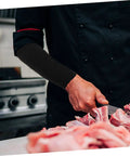 Heavy Duty Cut Resistant Arm Sleeves For Welding And Yard Work Shield Forearms From Gnarly Cuts And Scrapes In Durable Pe Blend worn during meat preparation.