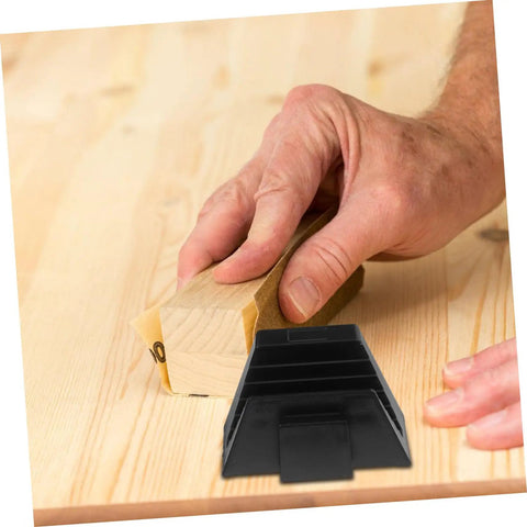 Hand holding a piece of wood with sandpaper, next to a 12 Piece Wrench Storage Rack Set Modular Organizer For Wrenches And Tools Tool Box Holder.