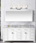 Chrome Farmhouse 4 Light Gooseneck Vanity Light above marble sink and white cabinet in modern bathroom.