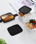 Open Pyramid Africa Desert Bento Box Leakproof Double Layer Lunch Box with compartments filled with food, on a white surface.