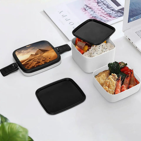 Open Pyramid Africa Desert Bento Box Leakproof Double Layer Lunch Box with compartments filled with food, on a white surface.