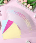 150 Pack Flower Bouquet Sleeves With Plastic OPP Wrapping Bags on pink surface with colorful paper accents