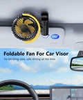 Battery Powered Clip On Car Fan For Visor And Back Seat in yellow clipped to car visor.
