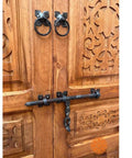 Rustic Dope Hand Carved Barn Door In Brown Finish with ornate patterns, no glass or hardware included, showing carving detail.