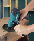 Beast 3.9 Amp 5 Inch Disc Sander Delivers 5000 RPM For Quick Material Removal With A Rubberized Soft Grip in use on wood surface