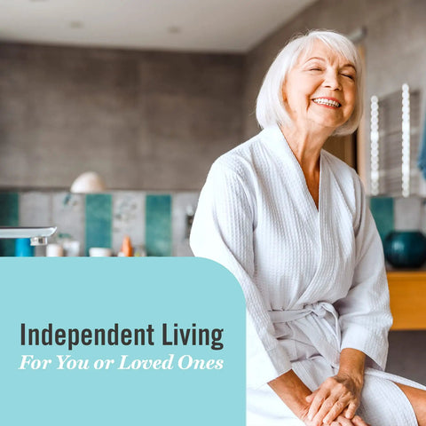 Smiling elderly woman sitting in a bathrobe beside text 'Independent Living for You or Loved Ones' in a modern bathroom.