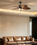 52" Tropical Ceiling Fan with Light, Indoor Outdoor Palm Leaf Ceiling Fan above a brown leather sofa in a modern living room.