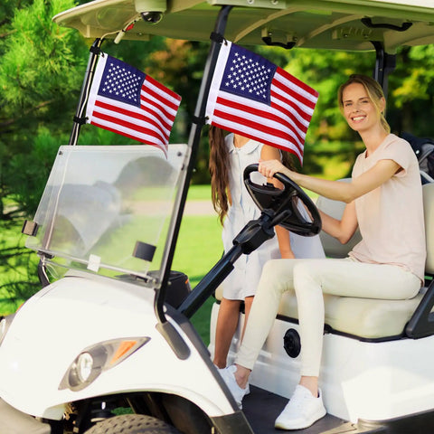 Two Pack 12X18 Golf Cart Flags With American Flag Embroidery And Elastic Strap Bracket on golf cart with smiling driver