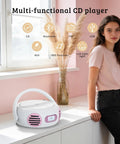 All In One Portable Boombox CD Player With Bluetooth for home or outdoors, displayed on a windowsill with a person nearby.