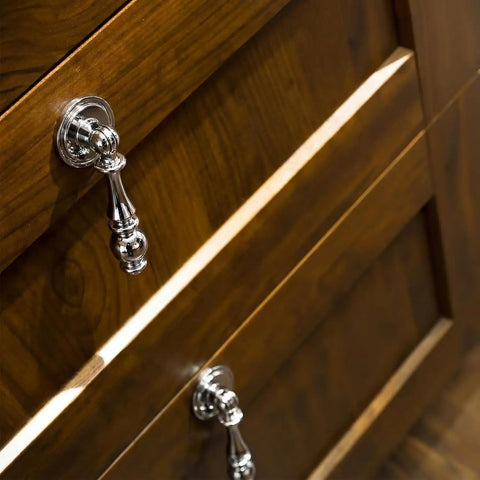 Vintage Drop Cabinet Pulls Polished Nickel Zinc Alloy Retro Dresser Knobs on wooden drawer close-up