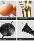 Close-up of Three Light Floor Lamp With Gold Plated Tripod Stand Modern Amber Glass Lampshade 28W Flexible Cozy Glow Light components