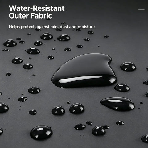 Close-up of water-resistant outer fabric showing droplets of water on a black surface, ideal for Premium Bike Tailgate Pad For Cybertruck Featuring Heavy Duty Hook And Loop Straps And Protective Cushioning To Keep Your Ride Locked And Loaded For Stress Free Weekday Hauls And Off Road Weekend Runabouts.