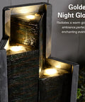 Modern Outdoor Water Fountain With LED Lights, 49.6 Inch Cascading Waterfall For Indoor Or Outdoor Use, illuminated at night with golden glow