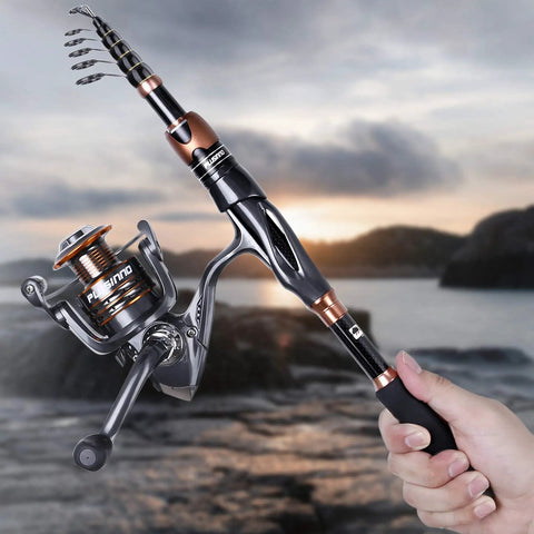 Person holding Bronze Warrior Toray IM6 Carbon Matrix Telescopic Fishing Rod And Spinning Reel Combo near water at sunset.