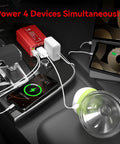 Heavy Duty 300W Car Power Inverter With Dual AC Outlets And Lightning Fast USB C PD 30W Plus Quick Charge USB A 18W Built For Tesla Model Y powering multiple devices in car interior.