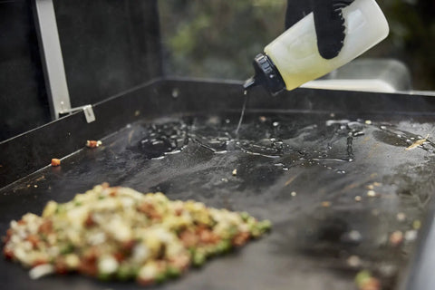 Using squeeze bottle from Griddle Essential 5 Piece Tool Set With Spatula Flexible Spatula Scraper And Two Squeeze Bottles For Breakfast