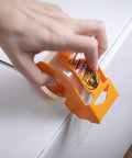 Person using Heavy Duty Packing Tape With Dispenser For Moving And Shipping, Extra Thick 3.4 Mil Crystal Clear Tape, 1.88in x 25yd