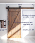 Heavy Duty Sliding Barn Door Hardware Kit in Black with Industrial Wheel Hangers, Includes Pull Handle Set and Floor Guide, Supports Doors Up To 220 Lb, Fits 36 To 40 Inch Wide Panels, 1 3 8 Inch Thick, Six Point Six Foot Track System installed on wooden door