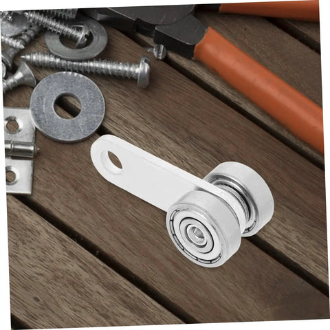 Heavy Duty Iron Dual Bearing Caster Wheels For Sliding Gates And Barn Doors featuring a close-up view of the wheel assembly on a wood surface.
