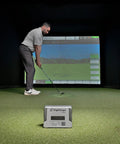 Man using Mevo Plus GPS Launch Monitor and Golf Simulator with Multicam Tracking indoors