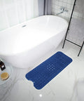 Extra Long Non Slip Bath Mat 39 X 16 Inch Machine Washable Shower Rug With Heavy Suction Cups And Fast Drain Holes Navy Blue next to a bathtub.