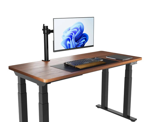 Single Computer Monitor Stand With Cable Management And Height Adjustable VESA Desk Arm Mount For 13 To 30 Inch Screens, Fully Adjustable Tilt And 360 Degree Rotation, Steel And Black on a wooden desk with a monitor.