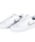 White sneakers with rhinestone design, captured at an angle from above, showcasing details suitable for Liquid Fusion Heavy Duty Craft Glue For Rhinestones And Glitter, Waterproof And Crystal Clear Dries Non-Toxic, Strong Bond For Diamond Art And DIY Projects, Indoor Outdoor 4 Fl Oz use.