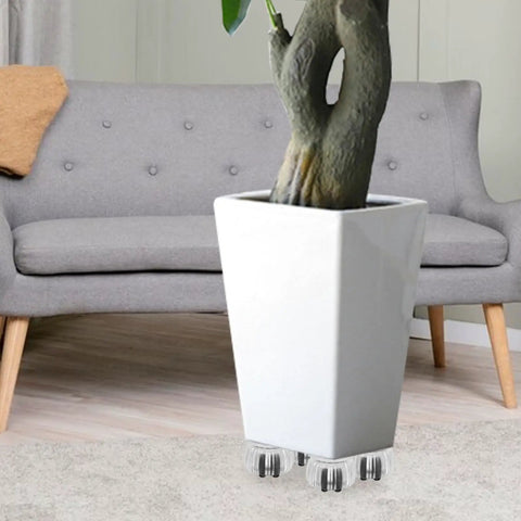 Furniture Caster Wheels with Brake, ABS Portable Base for Dresser under a potted plant, clear wheels on a white planter.