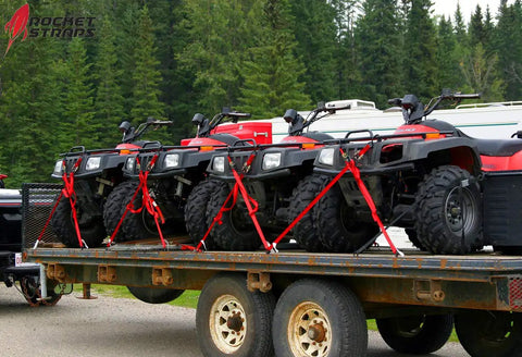 Beefy 4 Pack Ratchet Tie Down Straps With 1 Inch By 17 Feet Length securing ATVs on trailer