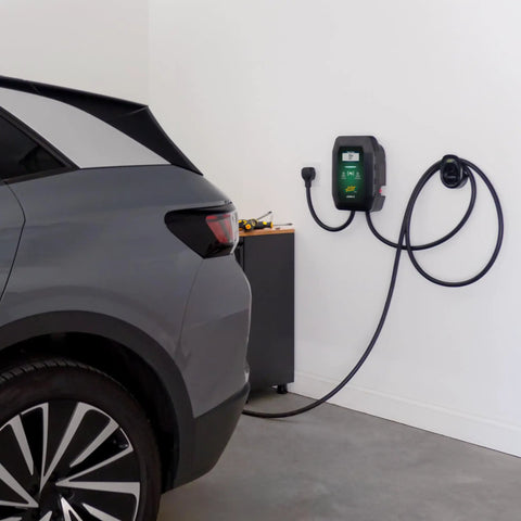 48 Amp Level 2 Wall Mounted Indoor Outdoor Fast Electric Vehicle Charging Station With 25Ft Flexible Cable Nema 14-50 Connector in garage beside vehicle.