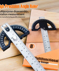 Heavy Duty Eight Inch Stainless Steel Angle Finder With 0 To 180 Degree Adjustable Protractor Ruler And Thumb Lock on a wooden surface.