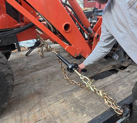 Four Pack Three Eighth Inch Grade 70 Binder Chain With Clevis Grab Hooks For Tow and Recovery G70 Transport Chain attached to machinery.