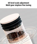 Top Shelf Electric Burr Coffee Grinder With 60 Precision Settings And 80G Single Dose Hopper showing scale and coffee beans.