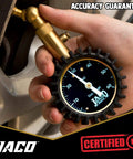 Front view of JACO Elite Tire Pressure Gauge with brass nozzle and rugged black rubber housing; 0–60 psi dial.