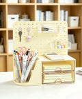 Desk Organizer With 360 Degree Rotating Pen Holder Five Slots Two Drawers Open Top Tray And Pegboard For Office School And Art Supplies Cream Finish Durable Space Saving Caddy To Reach Pens Pencils Markers And Accessories Quickly showing stationery, keys, and calculator.