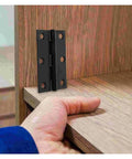 Rotating Concealed Hinges For Doors And Cabinets, Black Interior Small Shutter Hinge Set on wooden cabinet corner.