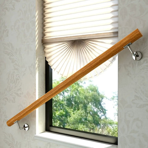Top Shelf Indoor Wooden Stair Railing Kit Round Banister Support 11 Foot Handrail Set For Home Steps mounted near a window.