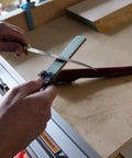 Person using Dia Fold Handy Portable Pocket Diamond Sharpener Double Sided With Extra Fine And Fine Grits on a knife