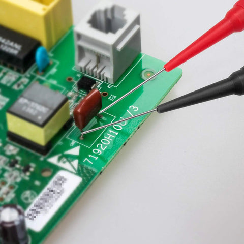 Four Pack 0.7mm Test Probe Pins With Non Destructive Insulation Piercing Needles, Stainless Steel Back Probe Pins in use on circuit board