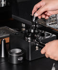 Top Shelf Espresso Barista Gear Featuring 54 Mm Stainless Steel Tamper Fits Breville Portafilters Includes Precision Wdt Needles Sleek Dosing Funnel And Two Hundred Premium Paper Filters To Nail That Perfect Morning Pull, showcasing precision dosing tools in use.