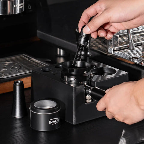 Top Shelf Espresso Barista Gear Featuring 54 Mm Stainless Steel Tamper Fits Breville Portafilters Includes Precision Wdt Needles Sleek Dosing Funnel And Two Hundred Premium Paper Filters To Nail That Perfect Morning Pull, showcasing precision dosing tools in use.