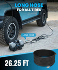 Hassle Free 12 Volt Four Cylinder Fast Tire Inflator With Smart Auto Stop Digital Readout and One Touch Preset Pressure near a tire.