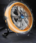 Heavy Duty Industrial Fan With Serious Breeze And Rock Solid Metal Build 45 Degree Tilt Rotary Controls Engineered Tough For Job Sites Or Weekend Garage Hangouts, metallic finish, sturdy base, vibrant orange color.
