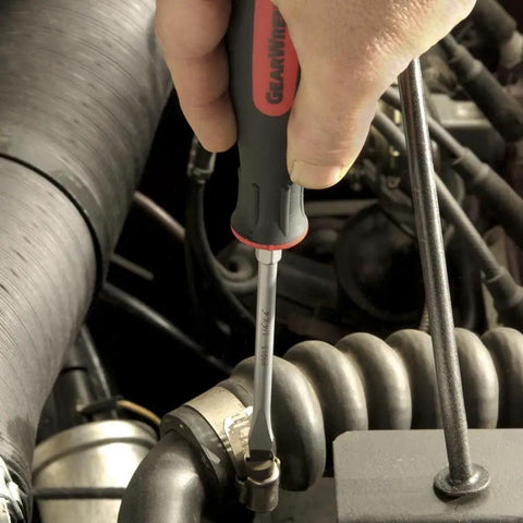 20 Piece Phillips Slotted And Torx Screwdriver Set With Ergonomic Tri Lobe Dual Material Handles And Speed Zone Design For Fast Comfortable Grips And Non Slip Bits For DIY Pros being used on an engine component.