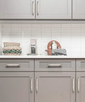 Installed 20 Pack Solid Zinc Alloy Cabinet Handles In Brushed Nickel, 3 Inch Center To Center, on grey kitchen cabinets.