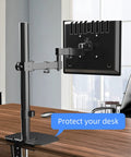 Kingpin Steel Reinforcement Plate for Glass Desk Adds Savage Stability to Monitor Mount Setup with Secure C-Clamp Grip and Zero Shake Guarantee for Desktop Vibe, mounted on a black monitor arm over a wooden desk.