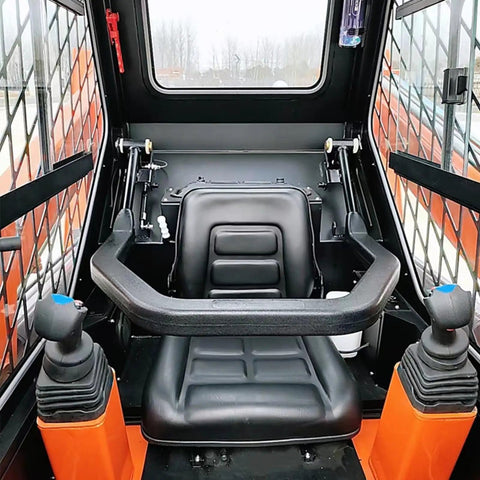 Interior of skid steer loader with Quick Connect System For Skid Steer Attachments That Makes Digging Loading And Hauling A Breeze