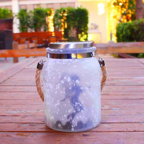 2 Pack Solar Lantern Fairy Lights For Outdoor Decor White Frosted Glass Hanging Jars With 20 Warm White Mini LEDs on a wooden table