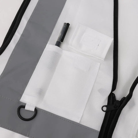 Close-up of white high visibility safety vest with five handy pockets and zipper, highlighting storage options.