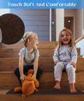 Children sitting on wooden stairs with Non Slip Stair Treads Carpet Indoor 14 Pack For Wooden Steps Anti Moving Stair Rugs.